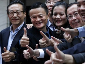 Alibaba Group Holding Ltd founder Jack Ma (2nd L) poses as he arrives at the New York Stock Exchange for his company's initial public offering (IPO) under the ticker "BABA" in New York September 19, 2014 